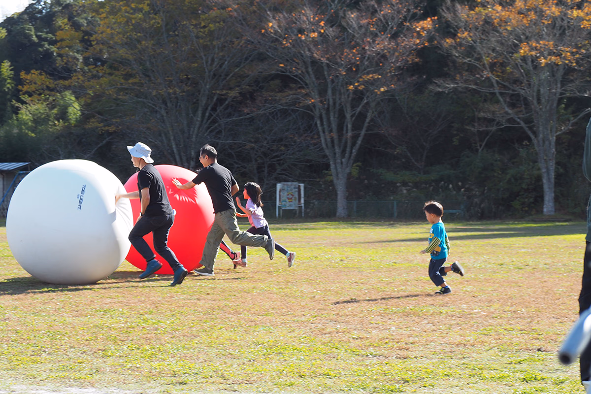 Rolling the big ball at the sports day