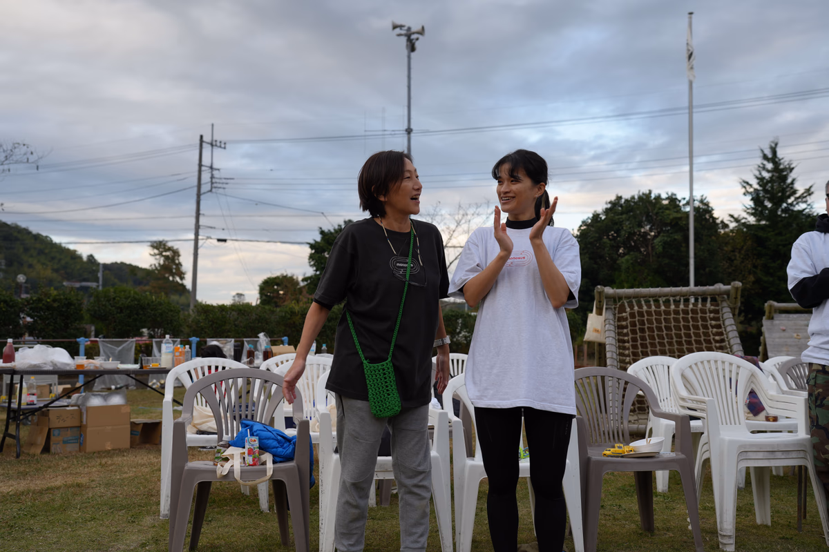 Two women laughing and talking