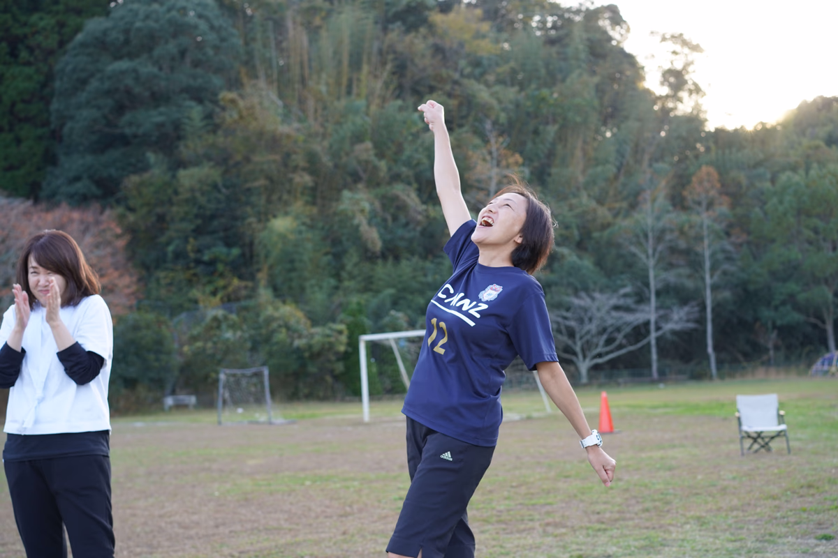 A woman pumping her fist in joy