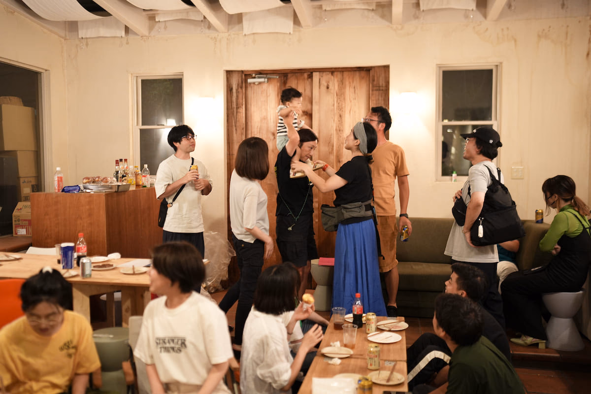 Four people laughing with beer