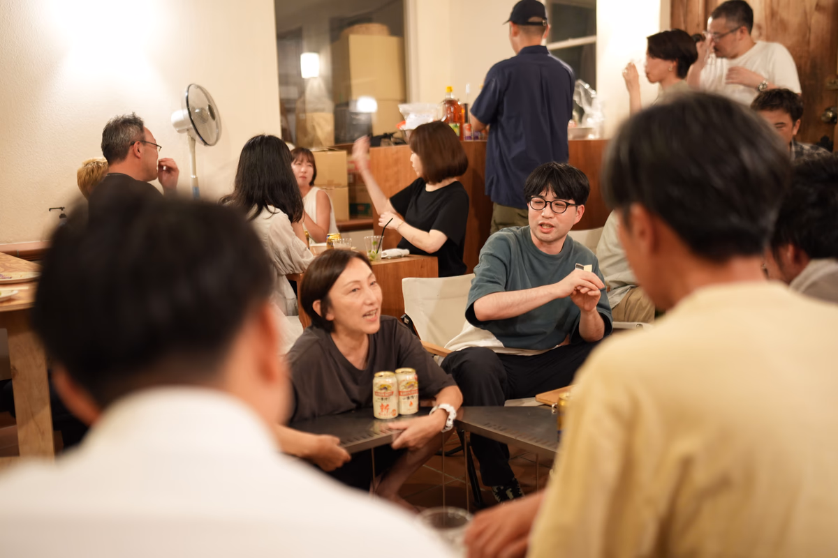 A woman speaking at the center of the group